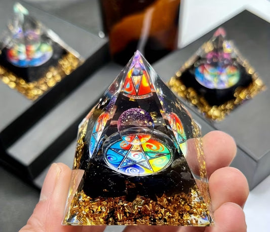 Handcrafted dream orgone pyramid with natural obsidian stones